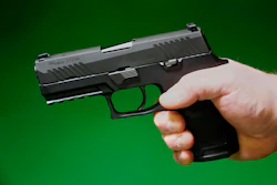 A Sig Sauer P320 handgun is held by a Maine gun shop owner, Tuesday, June 17, 2025.