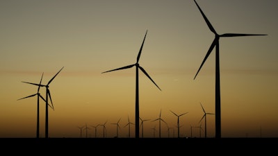 Wind turbines stretch across the horizon at dusk at the Spearville Wind Farm, Sept. 29, 2024, near Spearville, Kan.