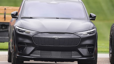 A Ford Mustang Mach-E sits in the players' parking lot Thursday, May 29, 2025, at the Denver Broncos' headquarters in Centennial, Colo.