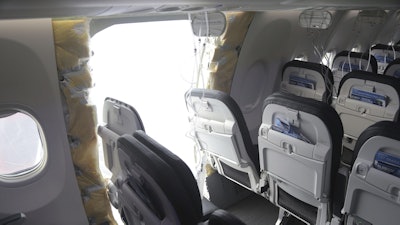 This image taken Jan. 7, 2024, and released by the National Transportation Safety Board, shows the section of a a Boeing 737 Max where a door plug fell while Alaska Airlines Flight 1282 was in flight.