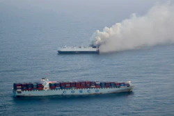 In this photo provided by the U.S. Coast Guard, smoke rises from cargo vessel Morning Midas approximately 300 miles south of Adak, Alaska, June 3, 2025.