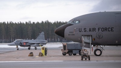 A JAS 39 Gripen C/D fighter jet, left, passes a US KC-135 Stratotanker, a US military tanker aircraft, during military exercise Nordic Response at Luleå-Kallax Airport near Luleå, Sweden, March 4, 2024.