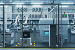 High-tech automated manufacturing facility with robotic arms and control systems.