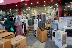 People purchase air conditioners at a shop on a hot summer day in Srinagar, Indian-controlled Kashmir, June 24, 2025.