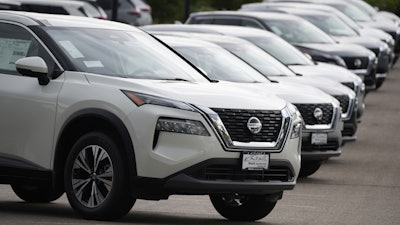 Unsold 2021 Rogue sports-utility vehicles sit on a lot at a Nissan dealership Colorado on June 27, 2021.