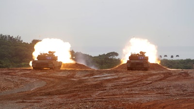M1A2T Abrams main battle tanks fire during a military live-fire shooting training in Hsinchu County, Taiwan, Thursday, July 10, 2025.