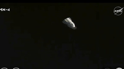 This image provided by NASA and Axiom Space shows a SpaceX capsule undocking from the International Space Station, Monday July 14, 2025, targeting a splashdown in the Pacific, carrying visiting crew Axiom Space's Peggy Whitson, Hungary's Tibor Kapu, India's Shubhanshu Shukla and Poland's Slawosz Uznanski-Wisniewski.