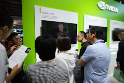 An exhibitor introduces the Nvidia DGX Spark to visitors at the Nvidia exhibition booth during the 3rd China International Supply Chain Expo at the China International Exhibition Center, in Beijing, Thursday, July 17, 2025.