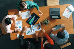 Business team analyzing data charts as part of a startup.