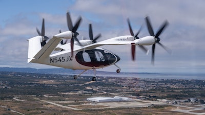 Joby’s new aircraft in flight over its expanded facility in Marina, California.