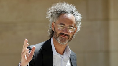 In this Wednesday, May 15, 2019, file photo, Palantir CEO Alex Karp arrives for the Tech for Good summit in Paris.