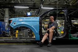 A vehicle assembly technician works on a 2025 Ford Expedition during a media tour to launch the 2025 Ford Expedition at the Ford Motor Company Kentucky Truck Plant, April 30, 2025, in Louisville, Ky.