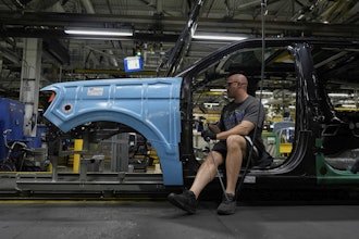 A vehicle assembly technician works on a 2025 Ford Expedition during a media tour to launch the 2025 Ford Expedition at the Ford Motor Company Kentucky Truck Plant, April 30, 2025, in Louisville, Ky.