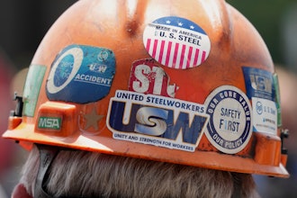 This is the back of the safety helmet worn by a steelworker listening to Pennsylvania Governor Josh Shapiro's meeting with media at the Clairton Coke Works, a U.S. Steel plant, in Clairton, Pa., Tuesday, Aug. 12, 2025.