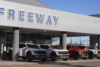 A long line of unsold 2024 pickup trucks sit on display at Ford dealership Thursday, Nov. 28, 2024, in southeast Denver.