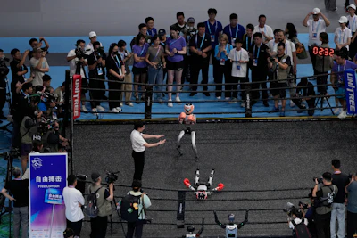 Robots participate in the Free Combat event at the World Humanoid Robot Games held in Beijing, China, Friday, Aug. 15, 2025.