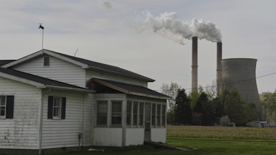 A home sits near the Gen. James Gavin Power Plant, a coal-fired power plant, April 14, 2025, in Cheshire, Ohio.