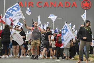 People protest outside Air Canada headquarters in Montreal, Sunday, Aug. 17, 2025, after the federal government is intervened in the labour dispute between the airline and the union representing its flight attendants, ordering binding arbitration and operations to resume.