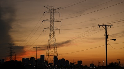Electrical power lines string across the landscape near downtown Sunday, Aug. 11, 2024, in Nashville, Tenn.