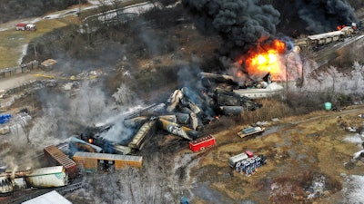 In this photo taken with a drone, portions of a Norfolk Southern freight train that derailed in East Palestine, Ohio, remain on fire, Feb. 4, 2023.