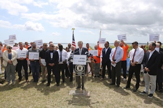 Rhode Island Gov. Dan McKee talks about the importance of the Revolution Wind offshore wind farm to the state's economy and energy future during a news conference in North Kingstown, R.I., on Monday, Aug. 25, 2025.