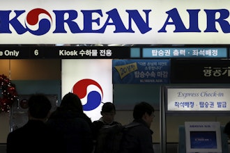 In this Dec. 16, 2014 photo, passengers wait to check in at the domestic check-in desk of Korean Air Lines Co. at Gimpo Airport in Seoul, South Korea.