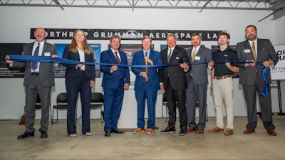 Mississippi Governor Tate Reeves, Tom Jones, corporate vice president and president, Aeronautics Systems, Northrop Grumman and representatives from the state of Mississippi and NEMCC cut the ribbon on Northrop Grumman Aerospace Lab.