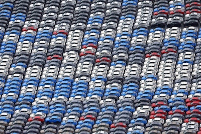 Vehicles are parked for export at a Yokohama port, near Tokyo on Aug. 1, 2025.