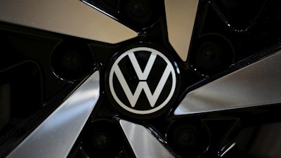 The logo of German car manufacturer Volkswagen is pictured at Volkswagen's transparent factory in Dresden, Germany, on May 14, 2025.