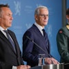 Norway's Prime Minister Jonas Gahr Store, center, flanked by Norway's Minister of Defense Tore O. Sandvik, left, and Chief of Defense Eirik Kristoffersen, reports on the status of the purchase of frigates from the United Kingdom, at the Prime Minister's Office in Oslo, Sunday, Aug. 31, 2025.