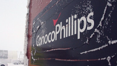 An ice-covered ConocoPhillips sign is displayed at the Colville-Delta 5, more commonly known as CD5, drilling site on Alaska's North Slope, Feb. 9, 2016.