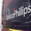 An ice-covered ConocoPhillips sign is displayed at the Colville-Delta 5, more commonly known as CD5, drilling site on Alaska's North Slope, Feb. 9, 2016.