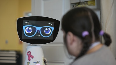 Robin the Robot visits with a patient at the HealthBridge Orange Specialty Pediatric Hospital in Orange, Calif., on Friday, Sept. 12, 2025.