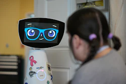 Robin the Robot visits with a patient at the HealthBridge Orange Specialty Pediatric Hospital in Orange, Calif., on Friday, Sept. 12, 2025.