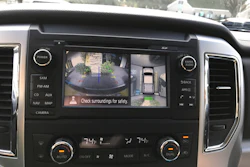 This photo provided by Edmunds shows a surround-view camera in operation in a 2016 Nissan Titan pickup, highlighting how it can make maneuvering in tight spots easier.