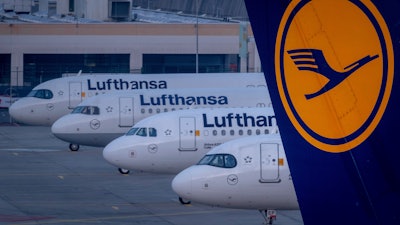 Lufthansa aircrafts are parked at the airport in Frankfurt, Germany, Thursday, March 7, 2024.