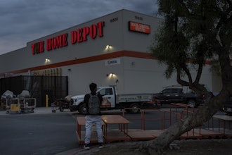 A day laborer waits for work in the parking lot of a Home Depot in the Van Nuys section of Los Angeles, Aug. 28, 2025.