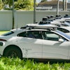 Row of self-hail autonomous driving taxi cabs owned and operated by Waymo.