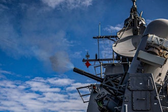 The Arleigh Burke-class guided-missile destroyer USS Rafael Peralta (DDG 115) fires a Phalanx Close-In Weapons System (CIWS) during a live fire exercise.