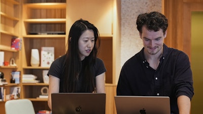 Claude code product manager Cat Wu, left, and Alex Albert, head of Claude relations, work inside Anthropic headquarters in San Francisco, Wednesday, Aug. 27, 2025.