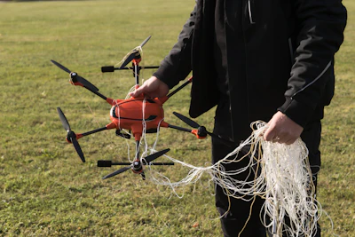 A person presents the interception of a drone by the A1-Falke interception drone from Argus Interception on the second day of the large-scale German forces Bundeswehr exercise 'Red Storm Bravo' in Hamburg, Friday, Sept. 26, 2025.