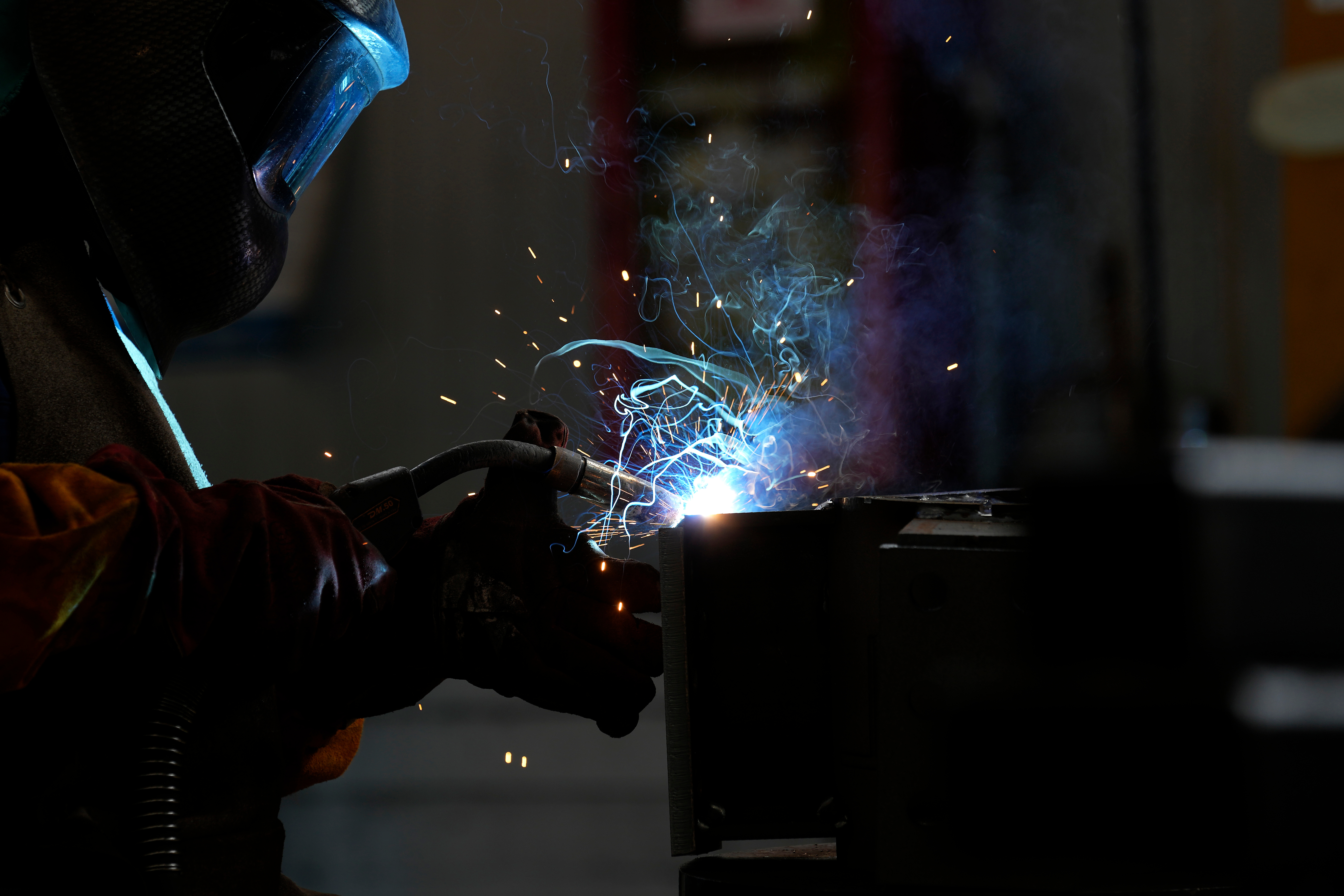 A man works at MAP, a factory operating in design, manufacture and installation of steel structures for civil and industrial use, in Corsico, Italy, May 12, 2022.