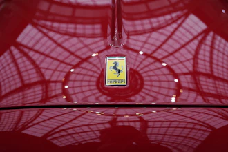 The Ferrari logo is photographed on a 1950 Oldsmobile Ferrari 166 MM Touring Barchetta displayed at the Grand Palais in Paris, Tuesday, Feb. 4, 2025.
