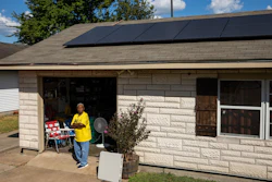 Doris Brown, Hub home captain, poses for a portrait under her solar panels on Wednesday, Oct. 8, 2025, in Houston.