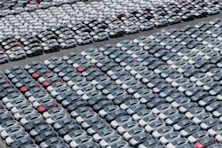 New cars for export wait for shipment at a port in Shanghai, China on May 11, 2025.