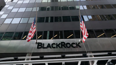 Flags fly on the front of BlackRock headquarters, Wednesday, Jan. 13, 2021, in New York.