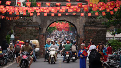 Vietnamese ride two-wheelers in the Old Quarter area in Hanoi, Vietnam, on Sept. 1, 2025.