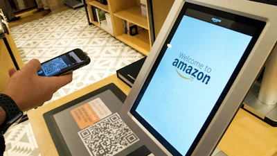 Daniel Thorpe, of Hoboken, N.J., uses the Amazon app to pay for his purchase at the Amazon 4-star store in the Soho neighborhood of New York, on Sept. 27, 2018.