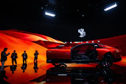 Members of the media and guests look at a Century's concept model during the press day of the Japan Mobility Show, in Tokyo, Thursday, Oct. 30, 2025.