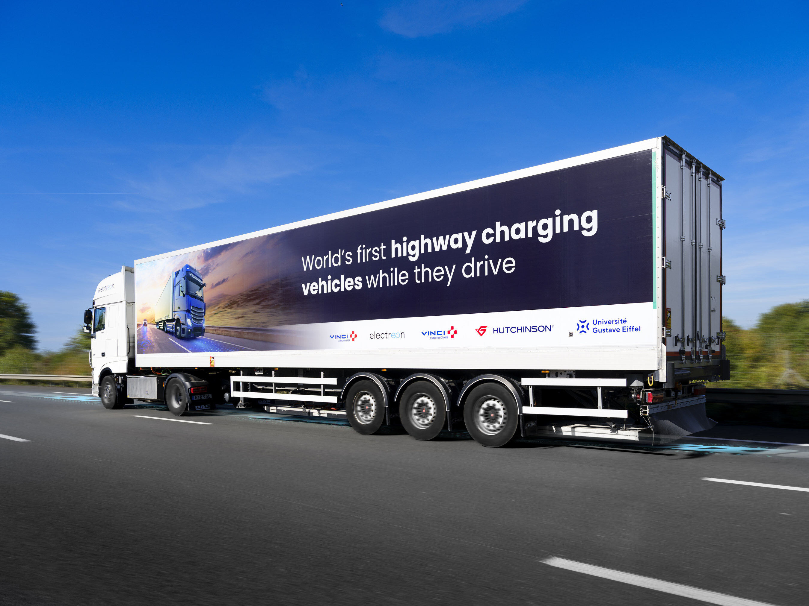 An e-truck charges while driving in France.